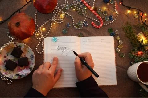 The hands are written in the diary Stock Photos