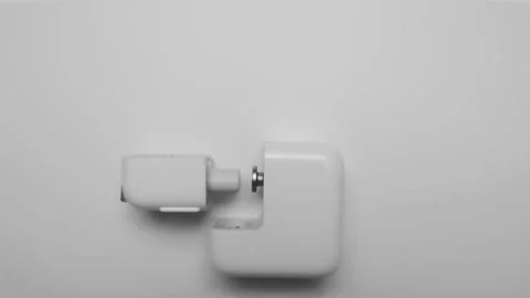 Hands arranging an iPhone detachable wall charger timelapse Stock Footage 161617296