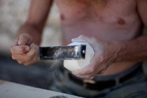 Hands of an artisan in the processing of limestone in the workshop Stock Photos