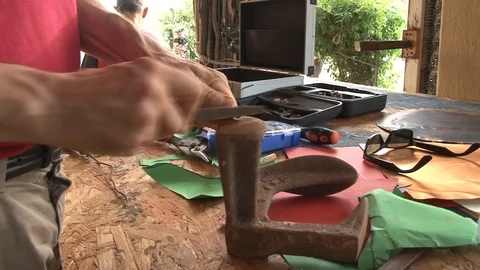 Hands of an artisan working metal in a construction site Stock Footage 117360271