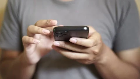 Hands of Asian man using smartphone Stock Footage 263091140