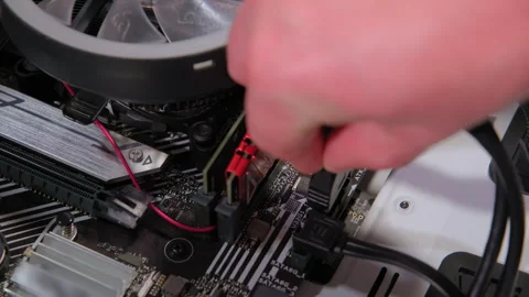 Hands assemble data link to mother board in PC. Stock Footage 267725495