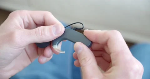 Hands assemble hearing aid, cochlear implant, close-up Stock Footage 172290342