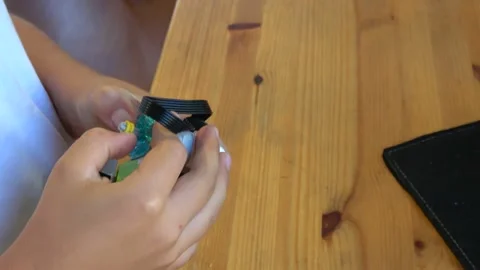 Hands assembling a mechanical device using programme in tablet computer Stock Footage 162567475