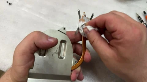 Hands assembling metallic component with copper tube, technical repair work Stock-Footage 344041370