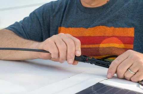 Hands Assembling Solar Power System with Copy-Space Stock Photos