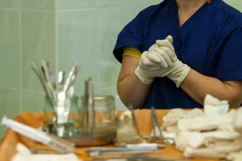 Hands of assistant surgeon Stock Photos