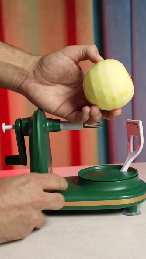 Hands Attaching Peeled Apple To Rotary Peeler Machine Stock Footage 345218979