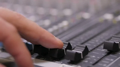 Hands of Audio engineer working on a professional analog console, moving faders 스톡 동영상 94505286