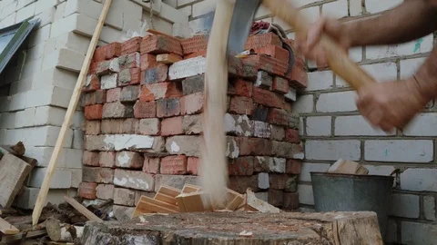 The hands with an axe are chopping a birch log in the backyard. Stock Footage 115598623