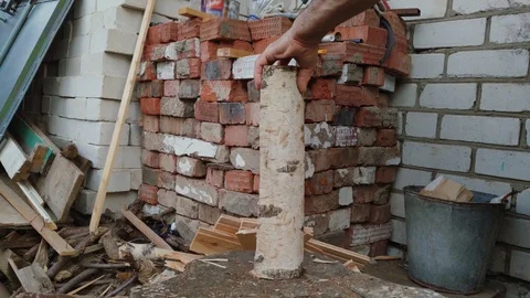 The hands with an axe are chopping a birch log in the backyard. Stock Footage 115599111