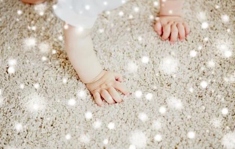 Hands of baby crawling on floor or carpet Stock Photos