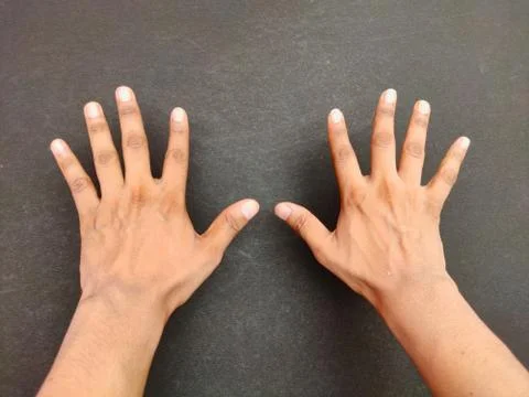 Hands back side Close-up, open hands with counting ten with fingers, on black Stock Photos
