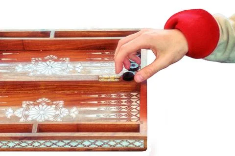 Hands of backgammon players, isolated on a white background. Two people are p 写真素材