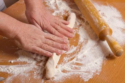 Hands of the baker Stock Photos