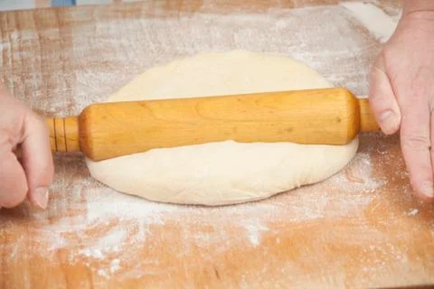 Hands baking dough with rolling pin Stock Photos
