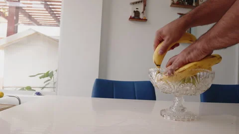 Hands with bananas in the latin kitchen Video stock 246512624