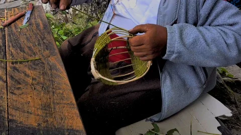 Hands of a basket maker are braiding a wicker basket, etara, bulgaria Stock Footage 94726607