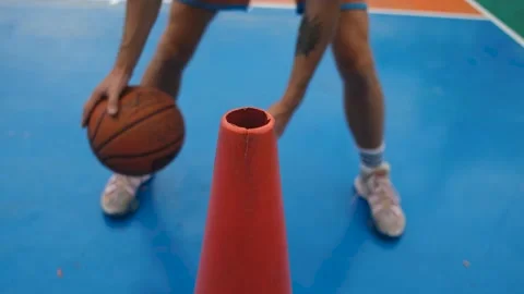 Hands of a basketball player in training with a cone 스톡 동영상 236984484