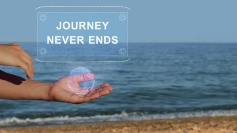 Hands on beach hold hologram text Journey never ends Stock Footage 106935317