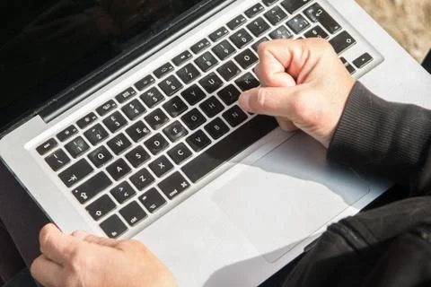 Hands beating on a notebook Stock Photos