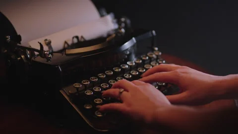 Hands Being Placed on a Typewriter Video stock 156534075