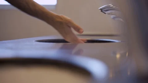 Hands being washed under automatic touch-less faucet or tap in public toilet Stock-Footage 112672196