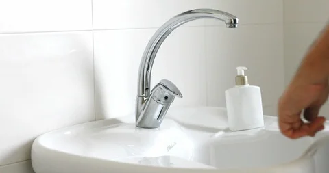 Hands being washed under the water flowing from faucet Stock Footage 126755169