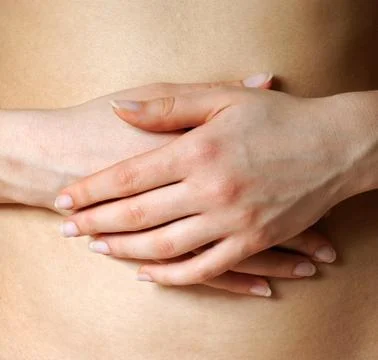 Hands on a belly Stock Photos