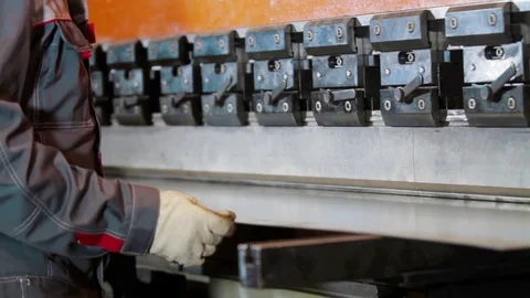 Hands bend sheet metal worker in the factory Stock Footage 83636697