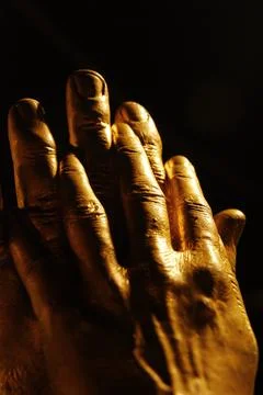 Hands in a black background Stock Photos