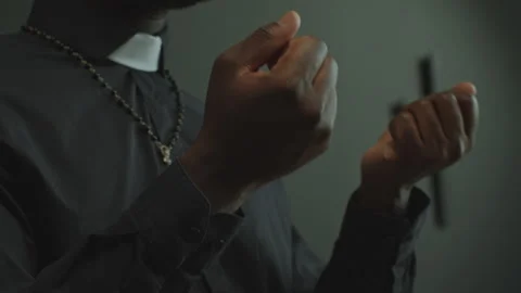Hands of Black Catholic Priest Speaking on Liturgical Service in Church Video stock 274101835