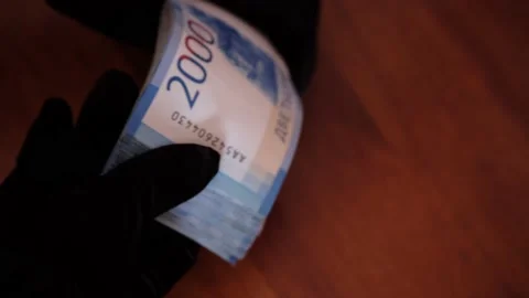 Hands in black gloves and a large pack of two thousandth Russian banknotes. Stock Footage 158431652