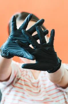 Hands with black gloves background. Close up. Stock Photos