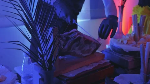 Hands in black gloves cut parma slowmo Stock Footage 102390108