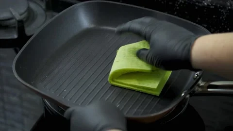 Hands in black gloves doing homework in the kitchen. Stock Footage 168636369