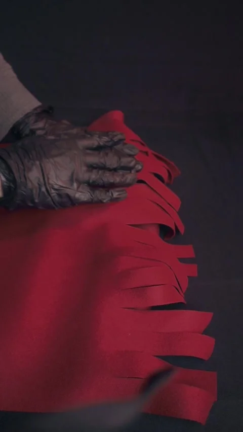 Hands in Black Gloves Handling Red Felt Fabric for DIY Craft Project Video stock 323453519