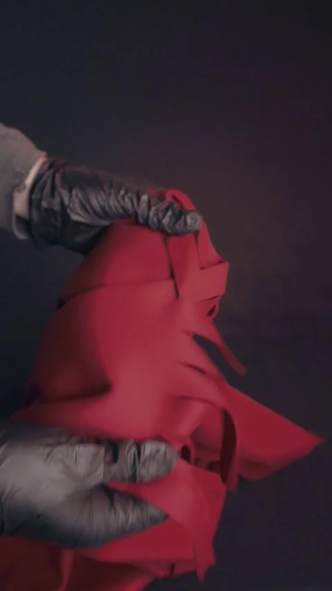 Hands in Black Gloves Handling Red Felt Fabric for DIY Craft Project Stock Footage 323453555