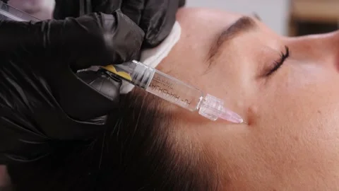 Hands in black gloves make injection with disposable syringe Video stock 196207775
