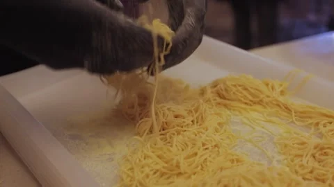  hands in black gloves making pasta Stock Footage 300028250