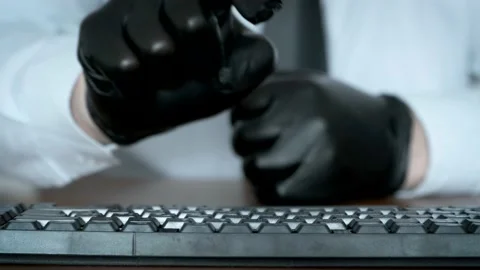 Hands in black gloves typing on the keyboard. Stock Footage 171309444