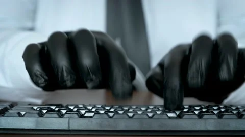 Hands in black gloves typing on the keyboard. Stock Footage 172565862