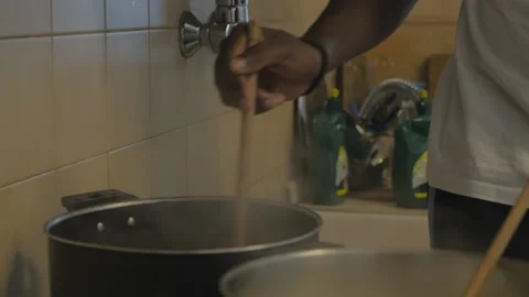 Hands of black guys preparing lunch in the kitchen. Stock Footage 211047665