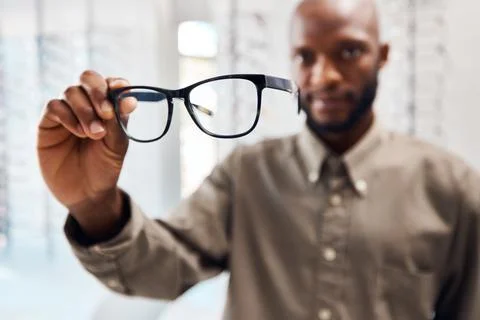 Hands, black man and optometry with glasses in store for inspection, frame .. Stock Photos