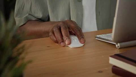 Hands of Black Man Clicking Wireless Mouse and Typing on Keyboard Stock-Footage 347652018
