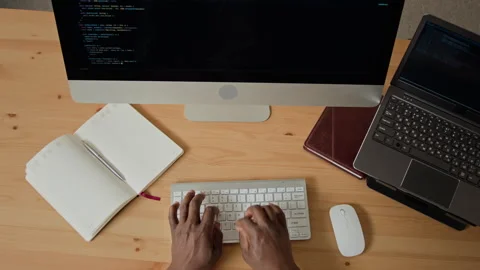 Hands of Black Man Typing Programming Code on Computer Keyboard Video stock 347657378