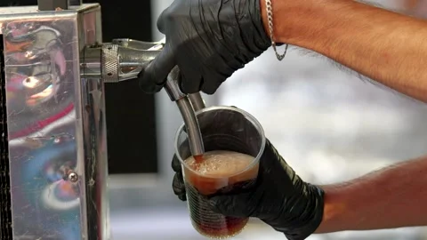 Hands in black plastic gloves drafting soft drink Stock Footage 316523552