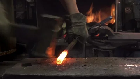 Hands of a blacksmith forging an iron blank Stock Footage 170686549
