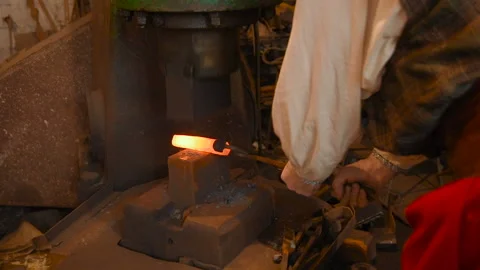Hands of a blacksmith with a tool Stock-Footage 104404176