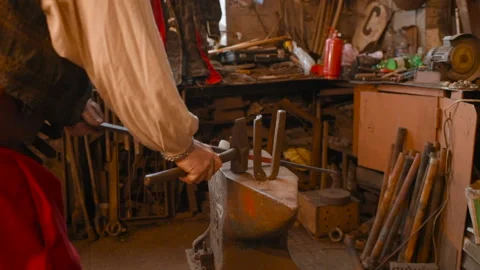 Hands of a blacksmith with a tool Video stock 116996782